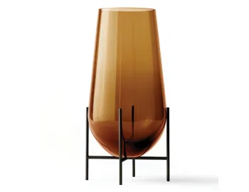 Large amber Échasse Vase with a tall tapered glass body raised on a dark four-legged stand