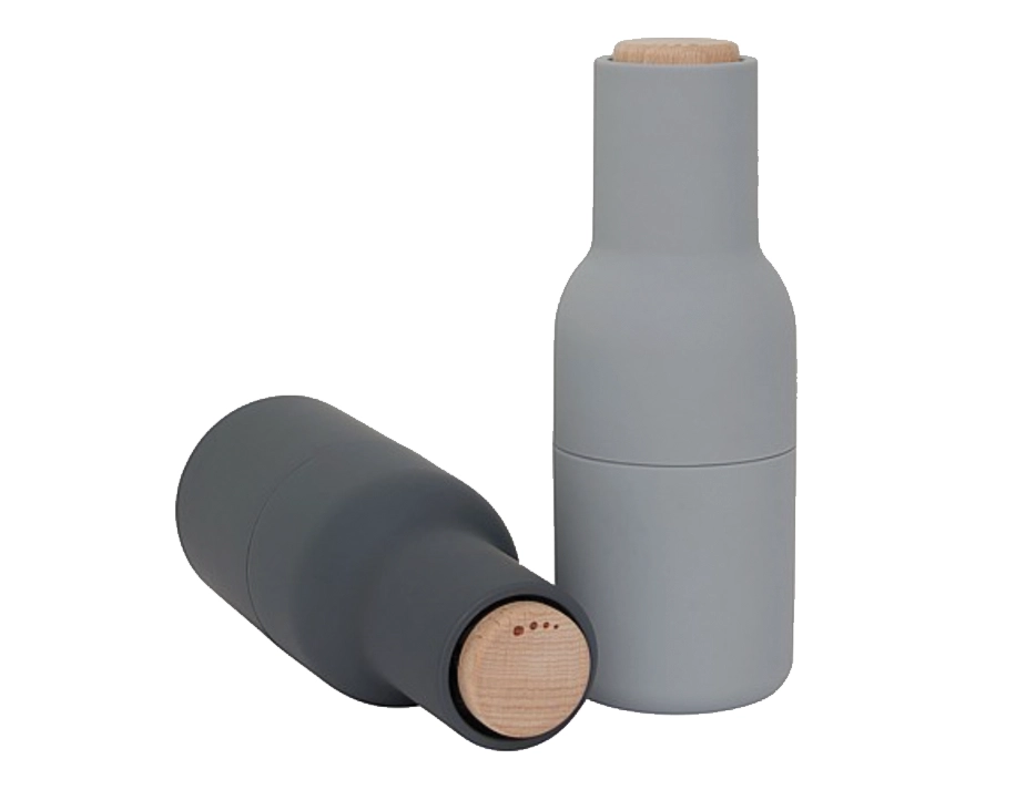 Dark grey Audo Bottle Grinder lying on its side to show the wooden adjustment lid beside a light grey grinder